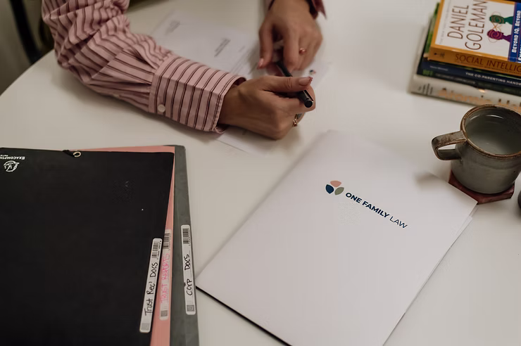 Couple signs separation agreement to refinance their home mortgage during divorce proceedings